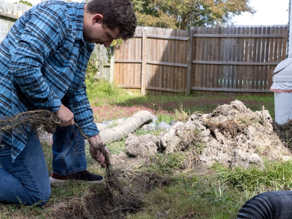 A man providing septic tank repair services.