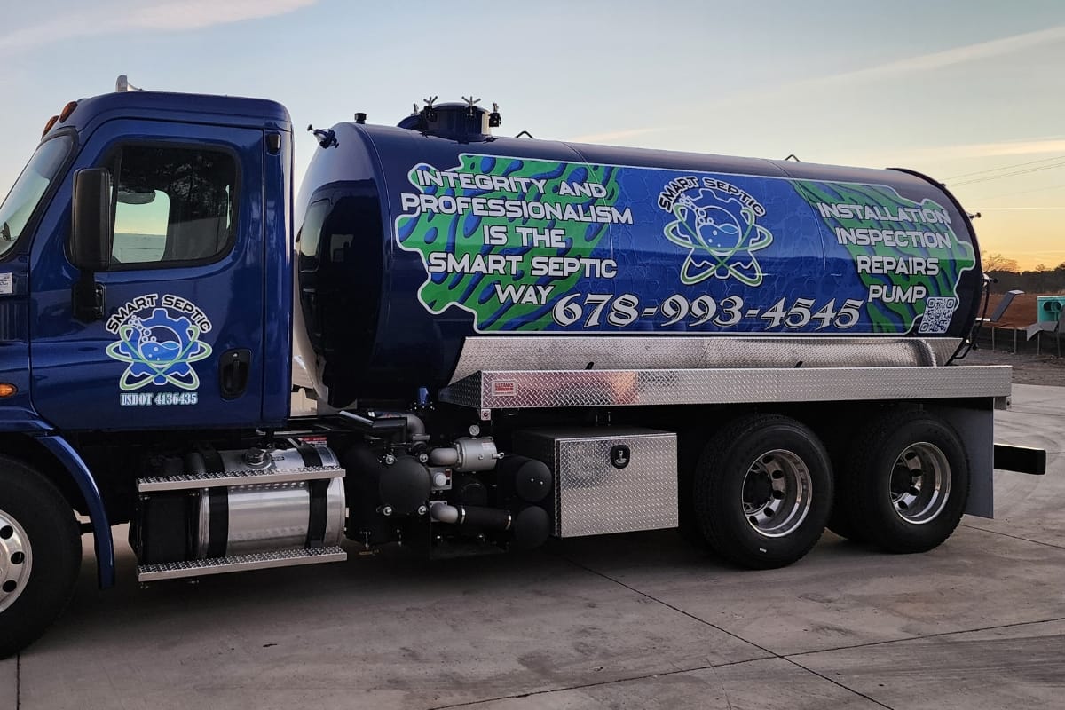 A septic service truck with blue and green graphics showcases a contact number and services like inspection, installation, and commercial septic tank pumping. The company motto is proudly displayed on the side.