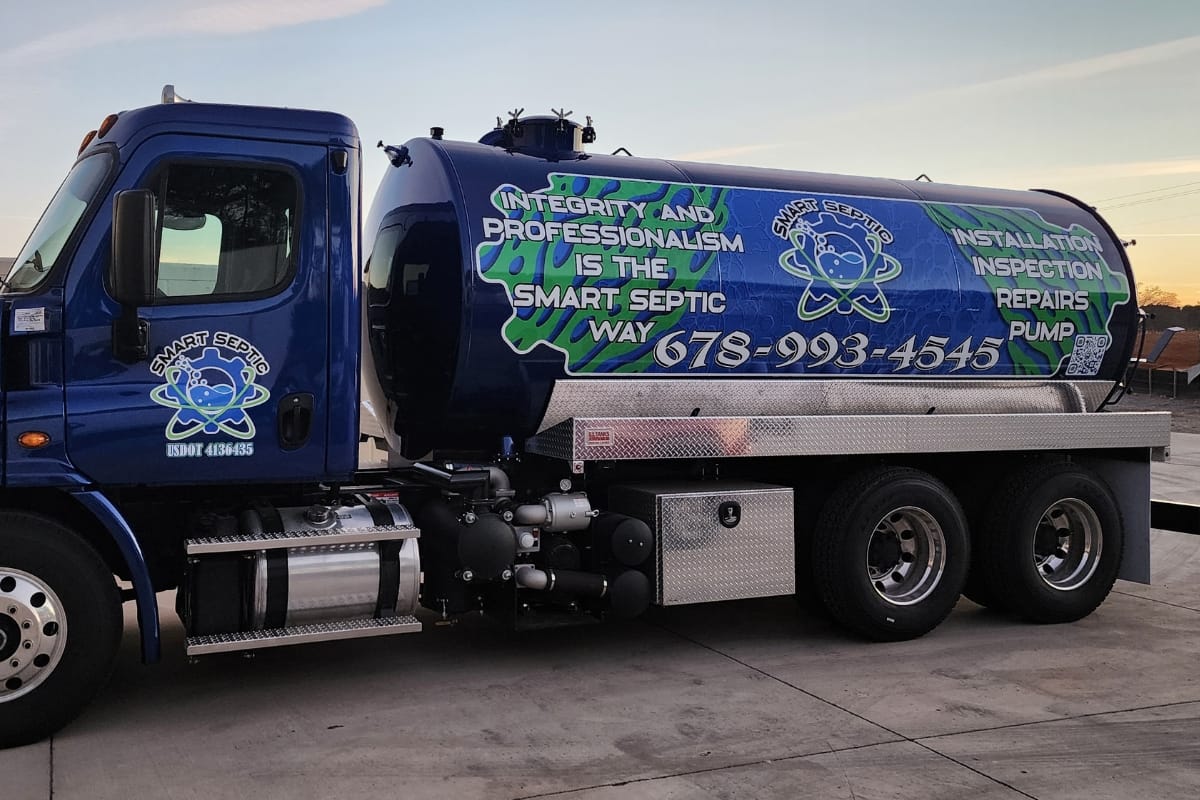 Septic service truck featuring a bold company logo, contact number, and a comprehensive list of services on the side, ready to tackle septic emergencies.